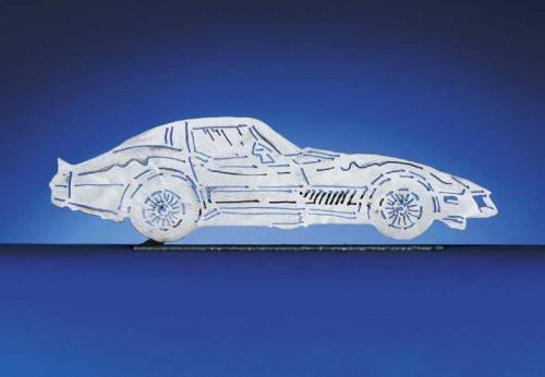 The 1982 C3 Corvette Coupe. Each CarArtWork Corvette sculpture is 17 inches long and is mounted on a flat metal base. The sculpture is securely attached to the base with a single metal rod affixed to the rear of the piece. The mounting rod is positioned so that its appearance is minimized from the front view of the sculpture. Each piece has a brushed metal finish and is coated with clear lacquer to preserve its luster.