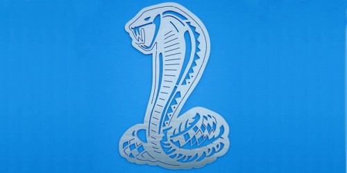 Add the perfect piece to your office with this 12 inch Ford Cobra Wall Hanging. It is a perfect addition to any office or garage to display your passion for the Ford Mustang SVT Cobra.