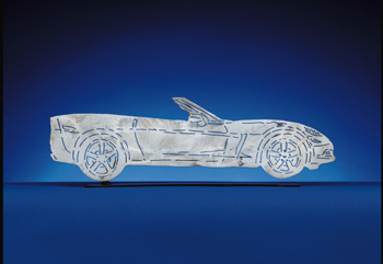 2005-2013 C6 Corvette. Each CarArtWork Corvette sculpture is 17 inches long and is mounted on a flat metal base. The sculpture is securely attached to the base with a single metal rod affixed to the rear of the piece. The mounting rod is positioned so that its appearance is minimized from the front view of the sculpture. Each piece has a brushed metal finish and is coated with clear lacquer to preserve its luster.