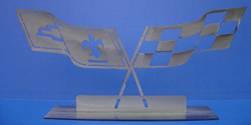 This 1977-79 Crossed Flags Wall Hanging will offer a great accent to an office, garage, or dealership. It's the perfect gift for that hard to shop for guy or gal and is constructed of stainless steal.