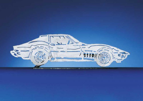 Each CarArtWork Corvette sculpture is 17 inches long and is mounted on a flat metal base. The sculpture is securely attached to the base with a single metal rod affixed to the rear of the piece. The mounting rod is positioned so that its appearance is minimized from the front view of the sculpture. Each piece has a brushed metal finish and is coated with clear lacquer to preserve its luster.
