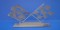 This 1967-76 Crossed Flags Wall Hanging will offer a great accent to an office, garage, or dealership. It's the perfect gift for that hard to shop for guy or gal and is constructed of stainless steal.