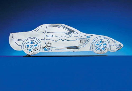 The 2001-2004 C5 ZO6 Corvette. Each CarArtWork Corvette sculpture is 17 inches long and is mounted on a flat metal base. The sculpture is securely attached to the base with a single metal rod affixed to the rear of the piece. The mounting rod is positioned so that its appearance is minimized from the front view of the sculpture. Each piece has a brushed metal finish and is coated with clear lacquer to preserve its luster.